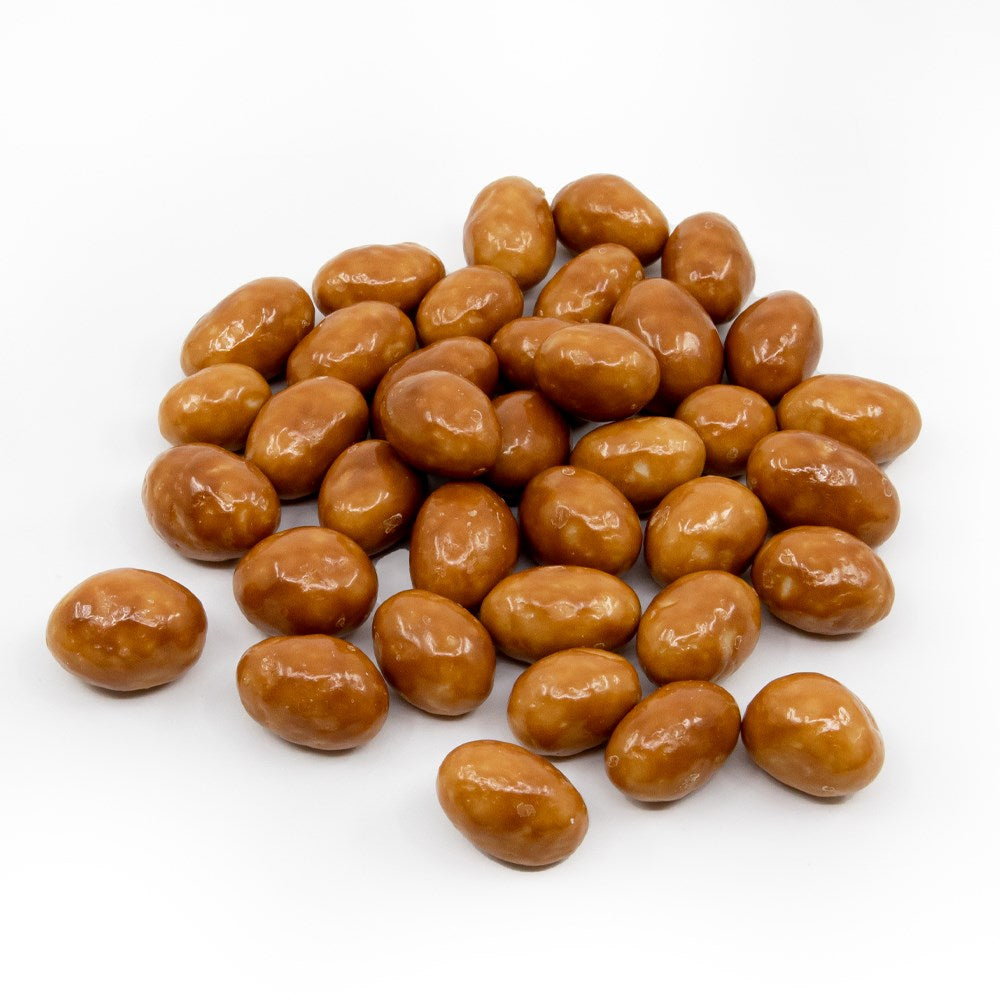 Premium whole pistachios coated in caramel and fine Belgian chocolate by La Belge.