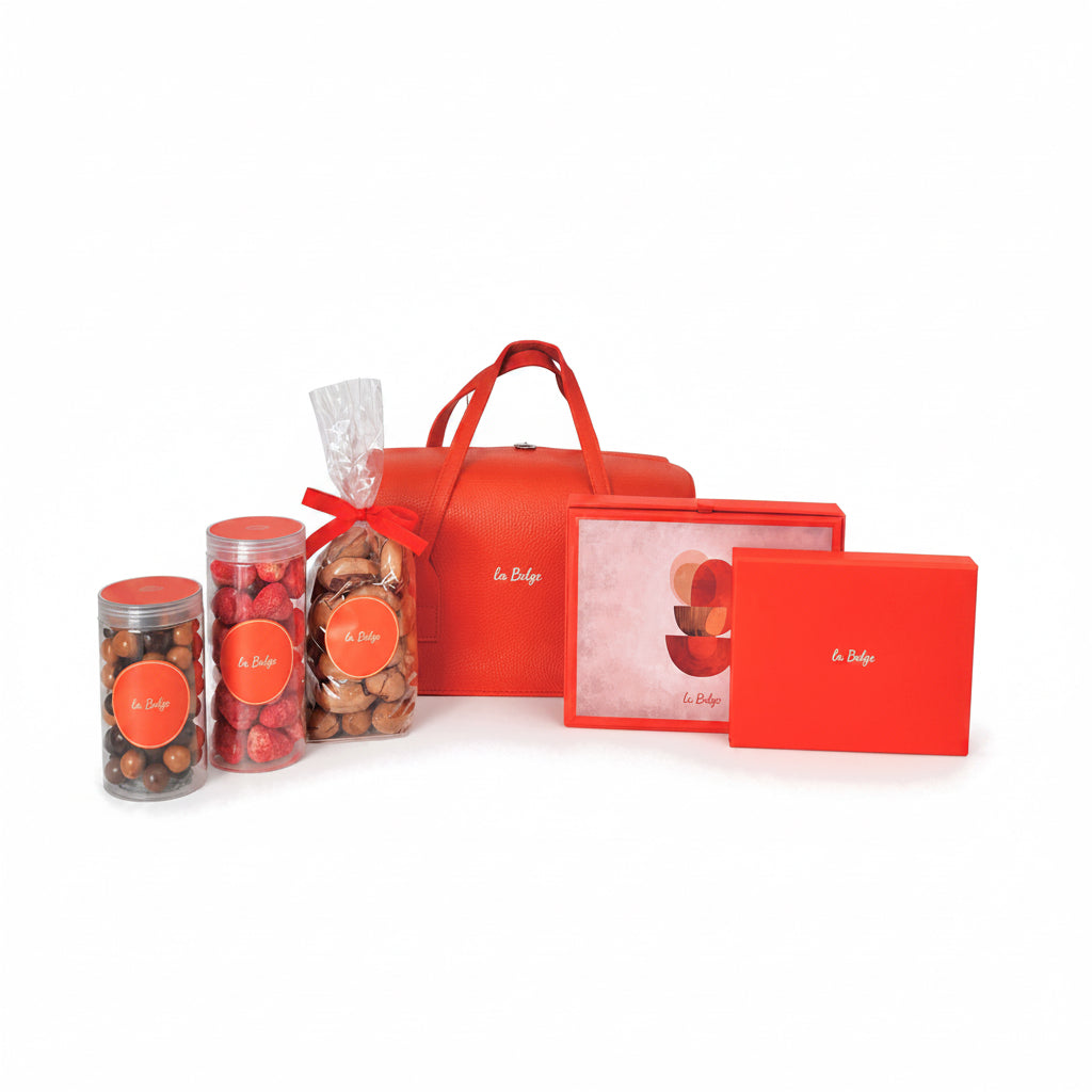La Belge leather bag gift set with chocolate domes, dried strawberries, mixed hazelnuts, pecans, and stuffed dates
